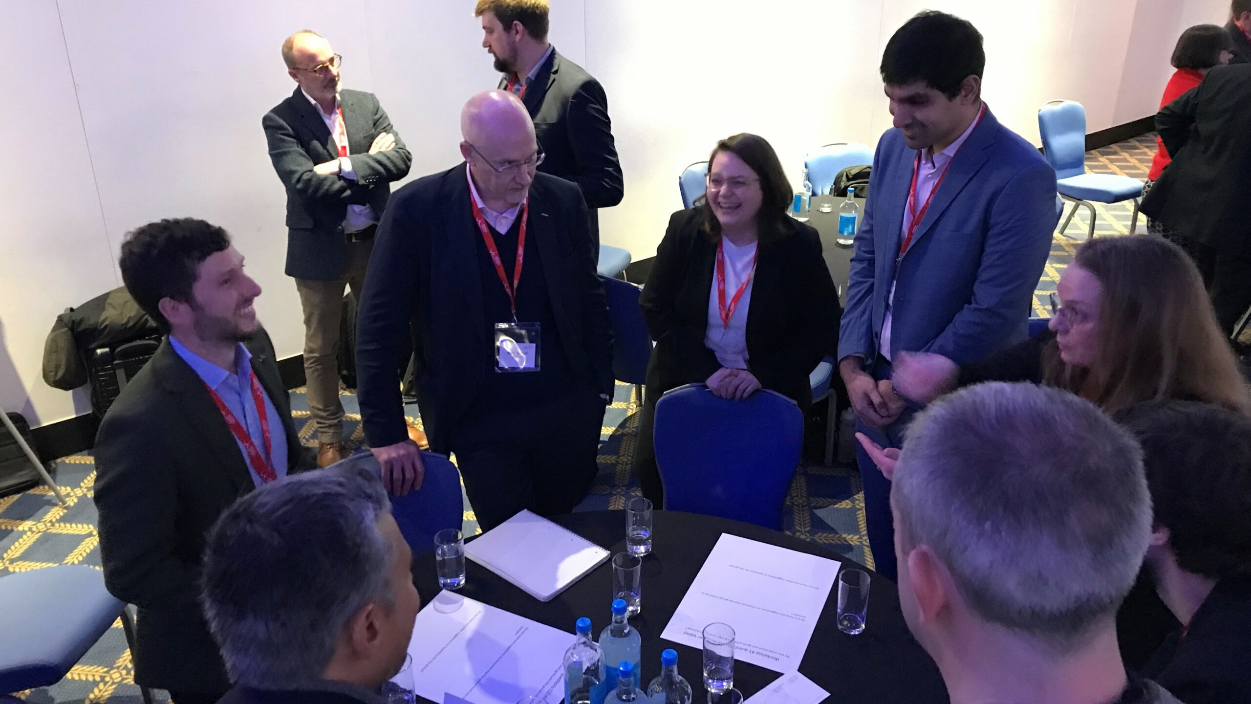 Advisory Group members discuss ideas around a table